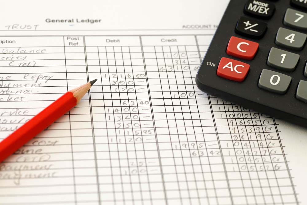 spreadsheets, ledgers, and a calculator