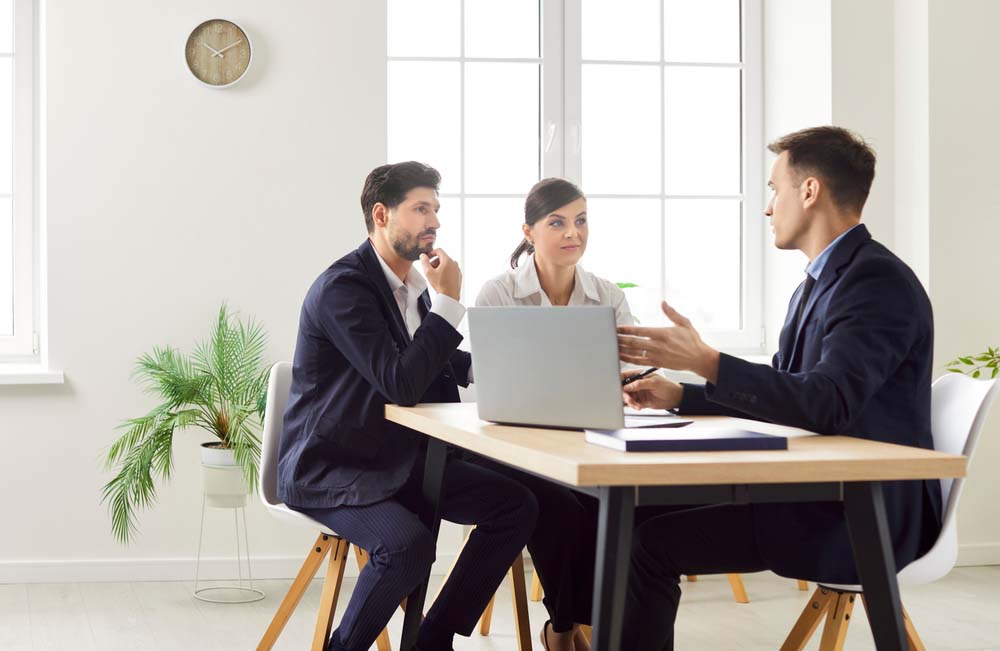 lawyer consulting a group of clients